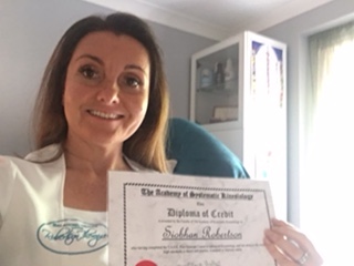 Image of Siobhan holding her diploma certificate