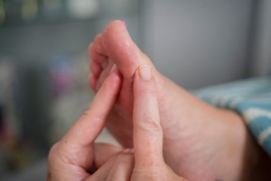 Image of a foot showing reflexology being given for Cancer Support