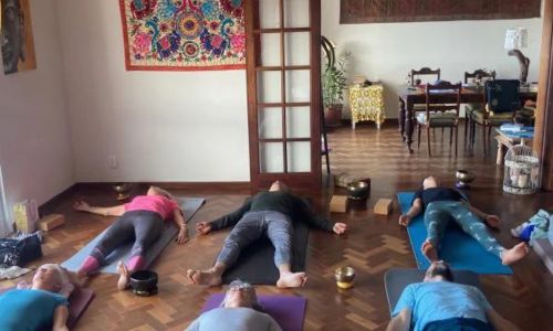 Photograph of a yoga class taking place at Villa Babel